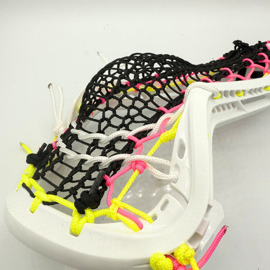 Close-up of a lacrosse head with colorful mesh on a white background