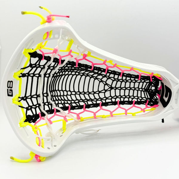 Close-up of a lacrosse head with white, yellow, and pink strings on a white background
